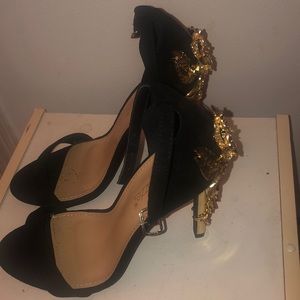High heels with gold detail on the heel